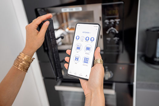 controlling-smart-devices-with-phone-on-the-kitche